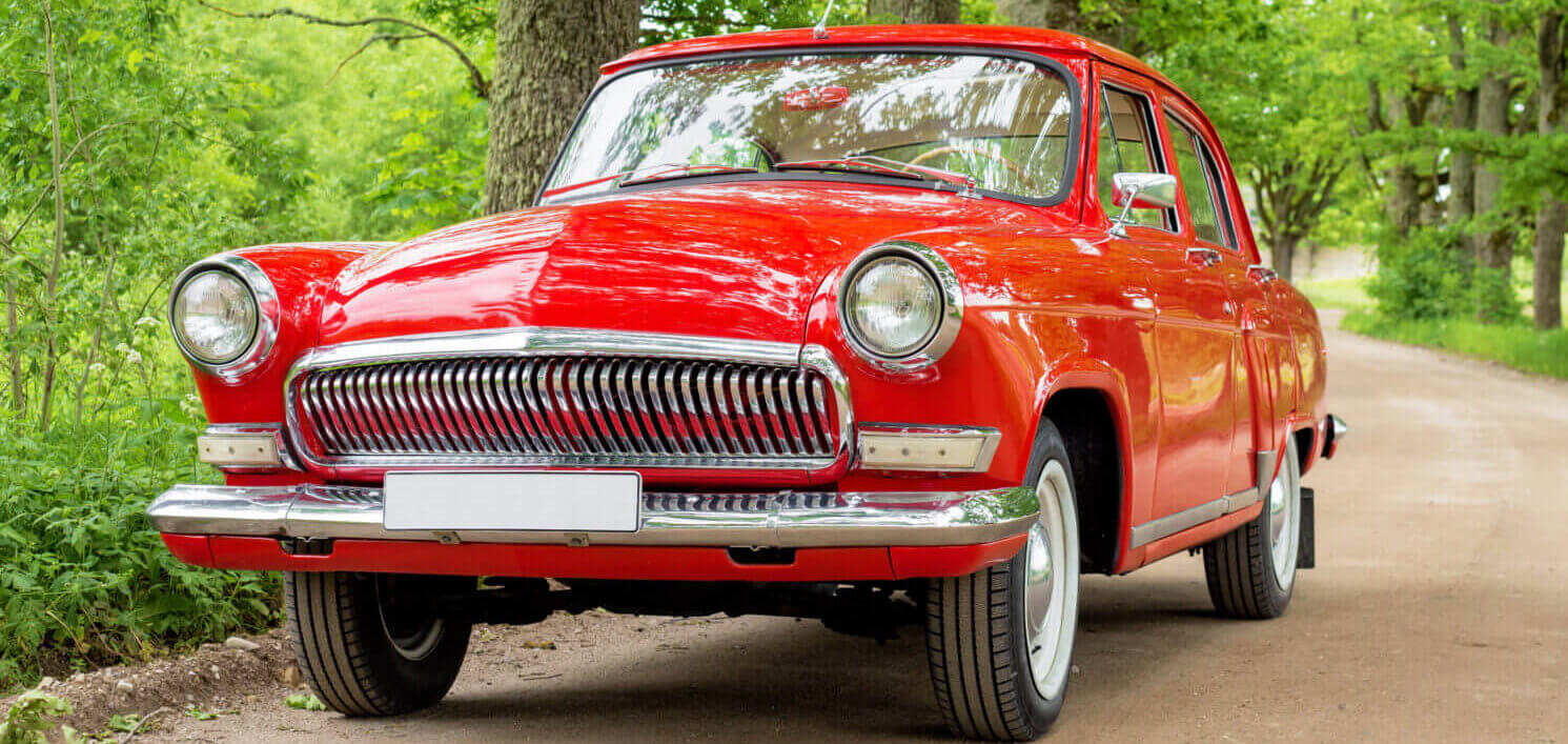 Red Vintage Car On Gravel Road